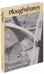 A journal cover with a black and white photograph if a wooden tool stuck in the dirt